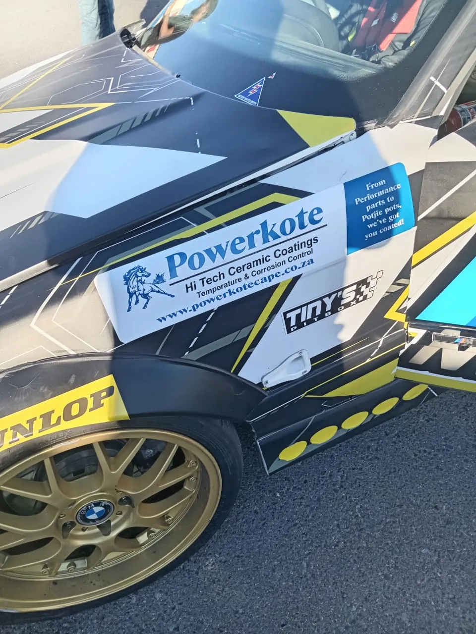 A race car with ceramic-coated components on track