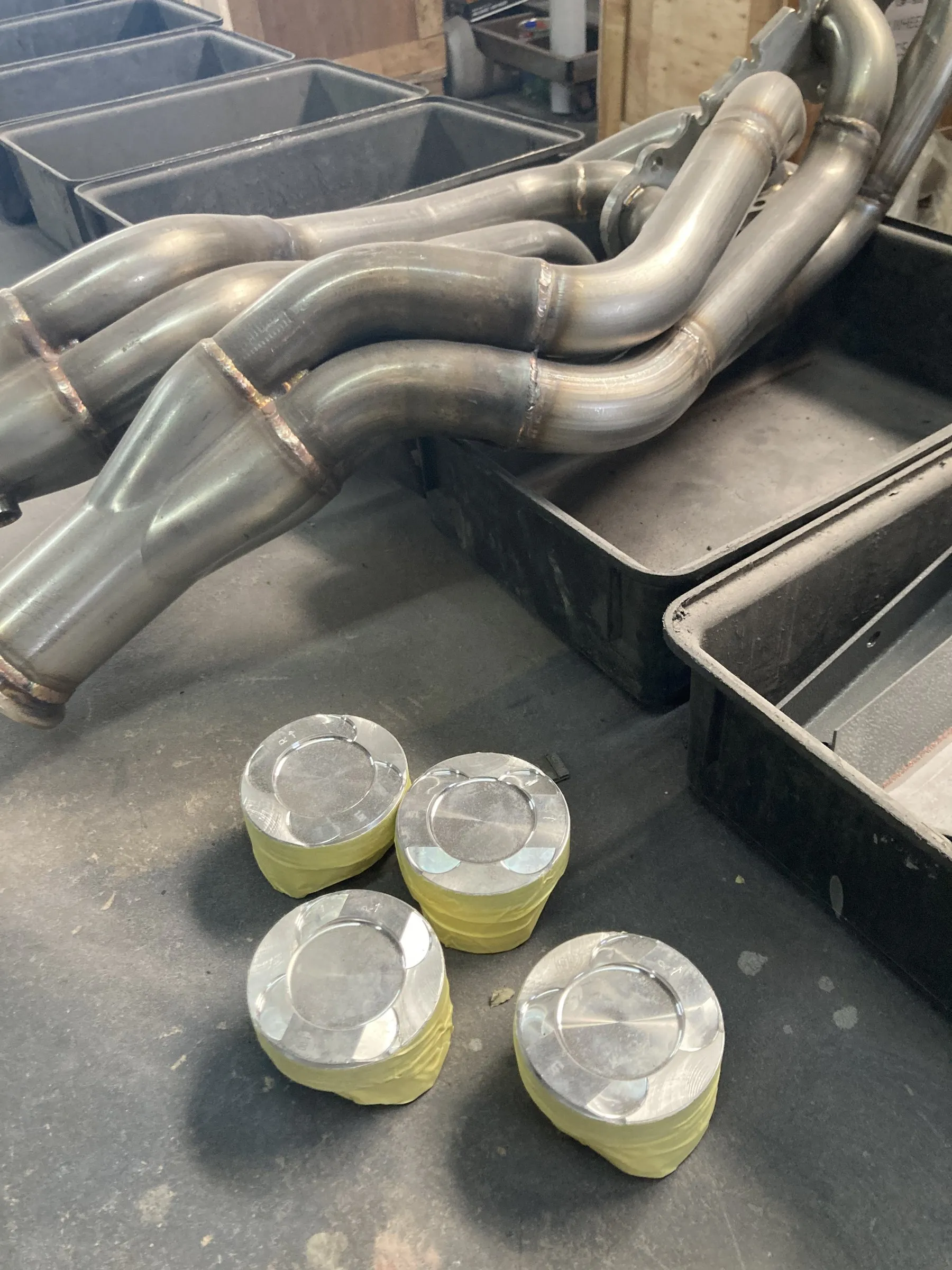 Bare-metal exhaust headers and pistons