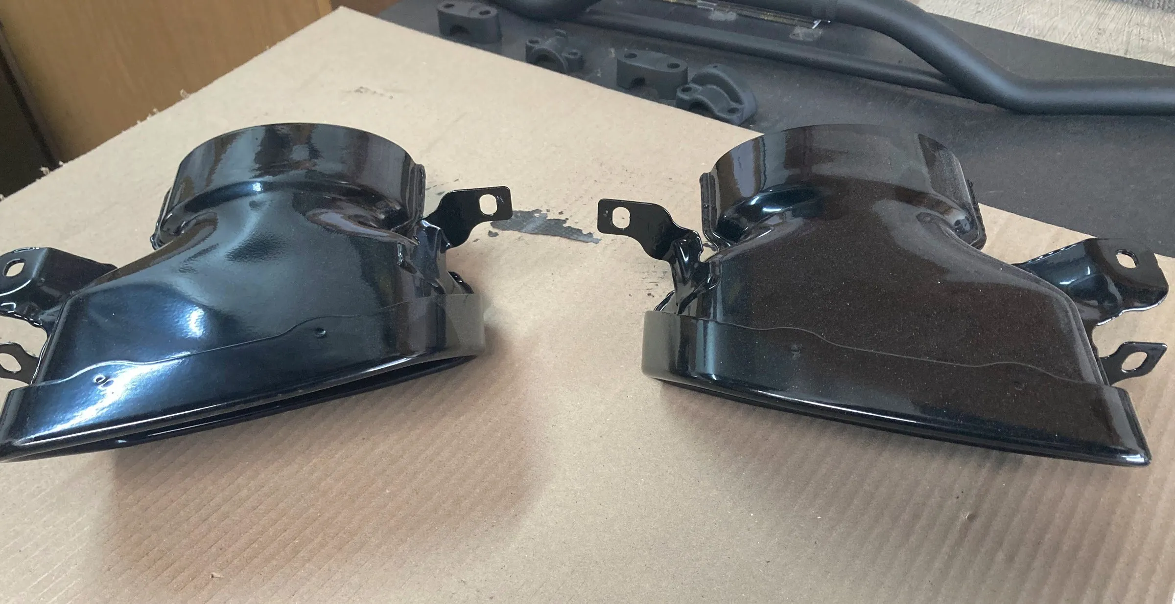 A pair of ceramic-coated exhaust tip surrounds