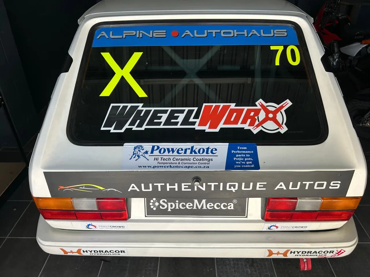 The rear livery of a GTI Challenge race car featuring Powerkote sponsorship