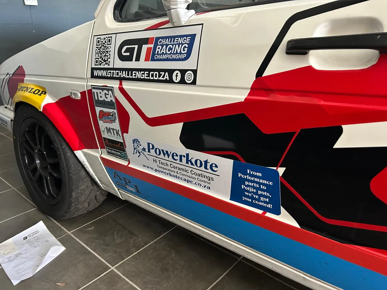 A GTI Challenge race car door panel carrying Powerkote sponsorship livery