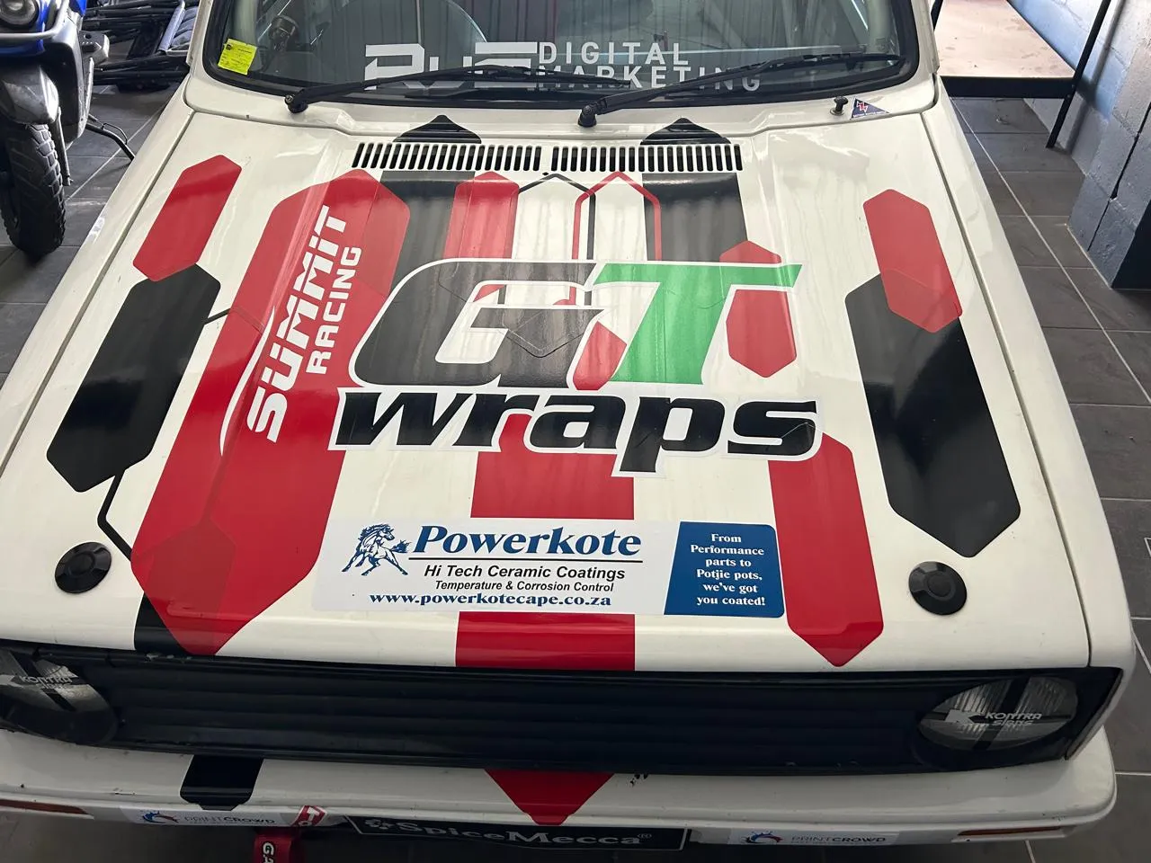 A GTI Challenge race car bonnet carrying Powerkote sponsorship livery
