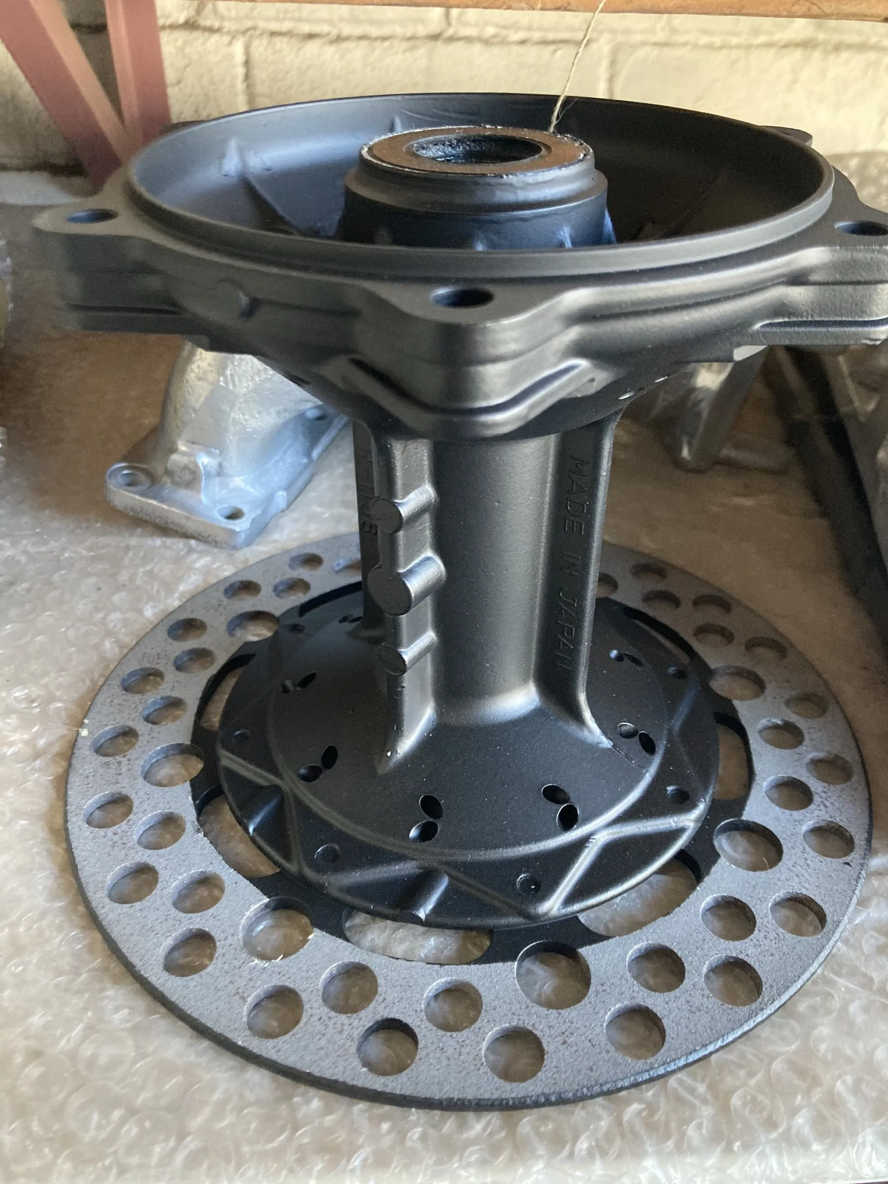 A ceramic-coated motorcycle wheel hub and brake disc