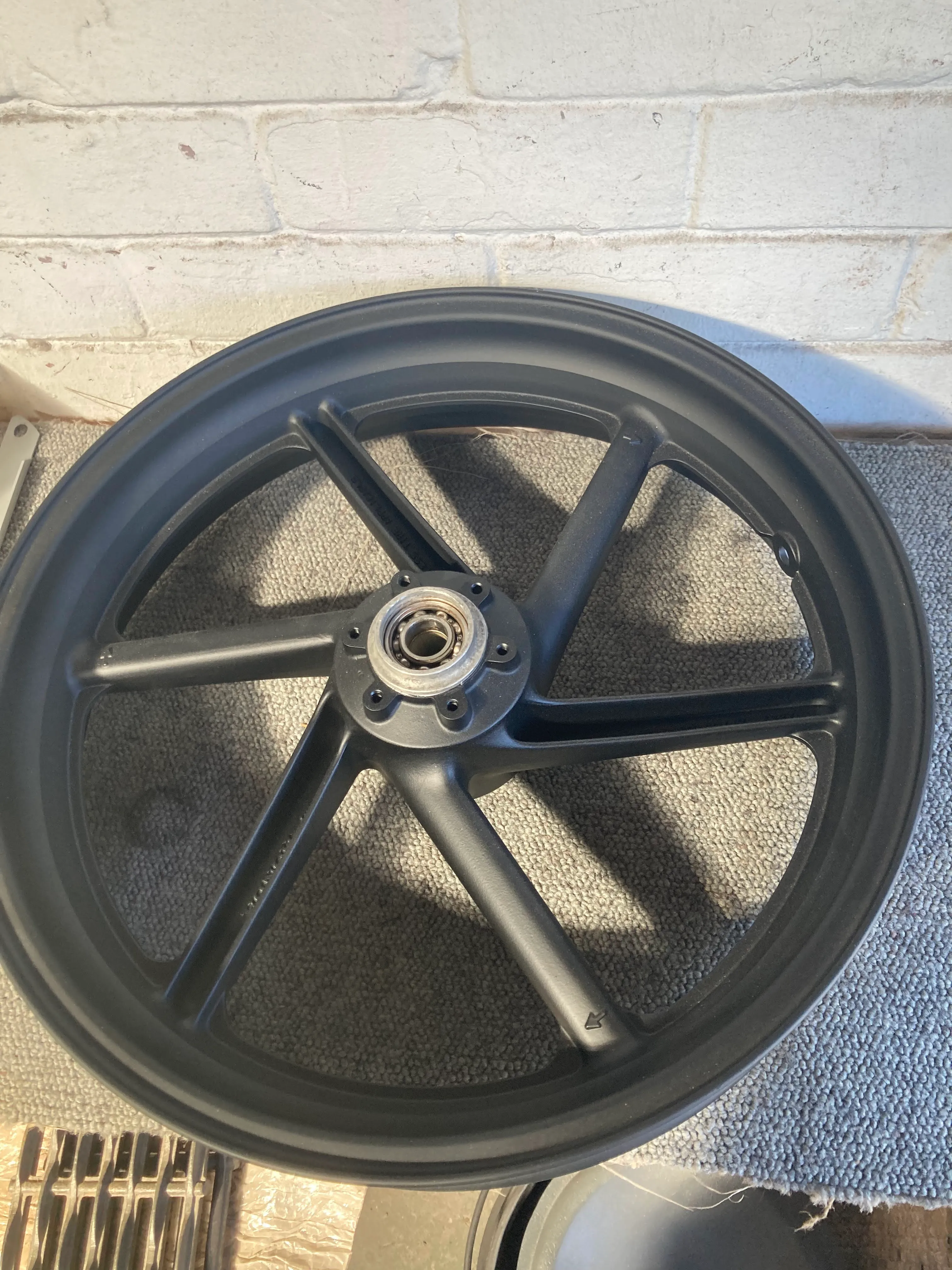 A ceramic-coated motorcycle wheel rim