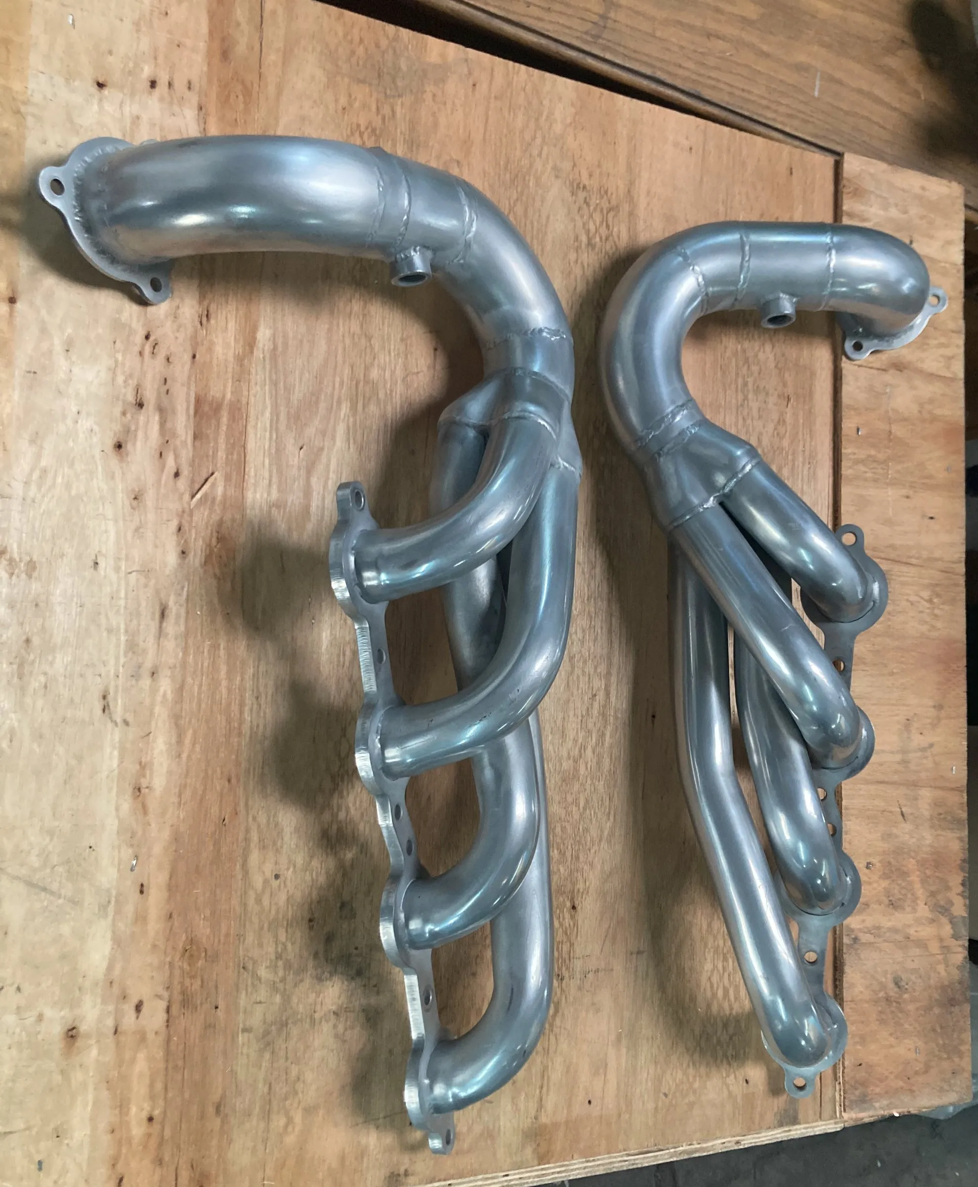 A pair of ceramic-coated V8 exhaust headers from a Volkswagen Beetle